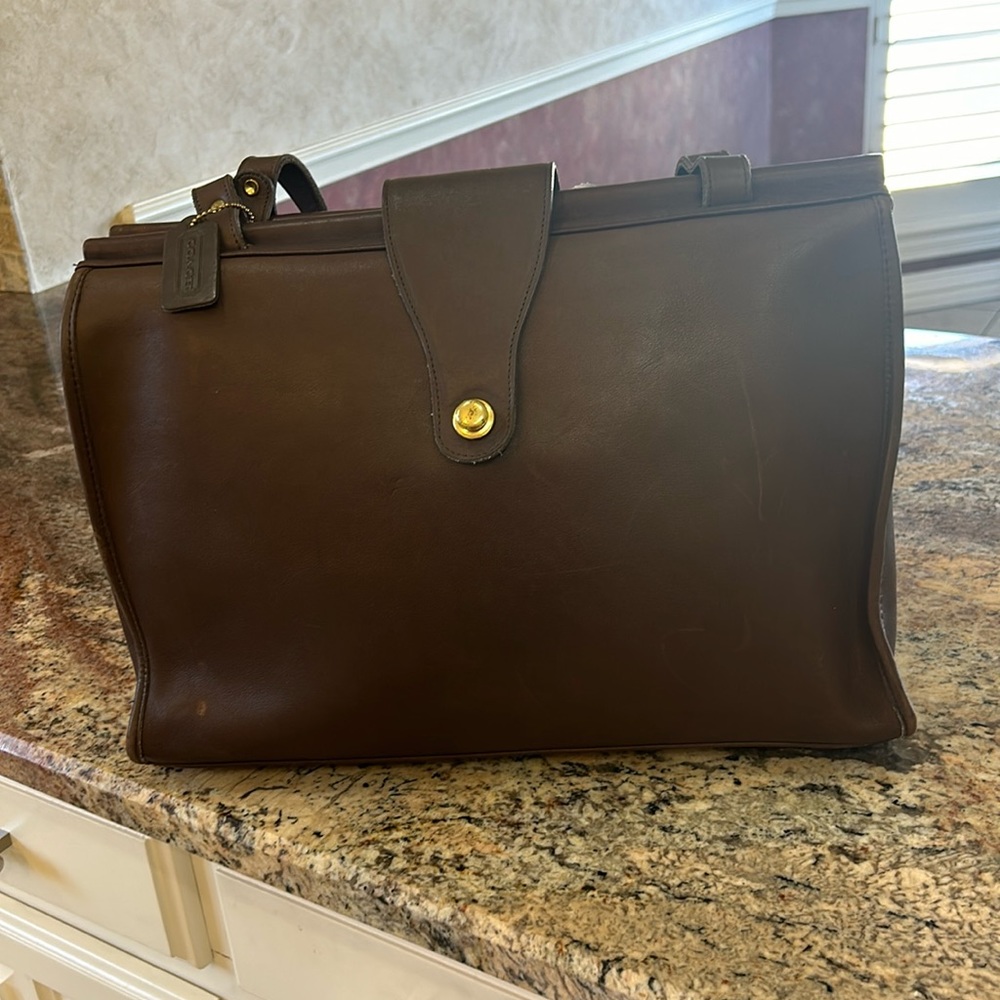Genuine Coach briefcase. Like new, hardly carried. Deep rich brown color.